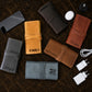 Close-up of leather cable organizer strap and hardware detail