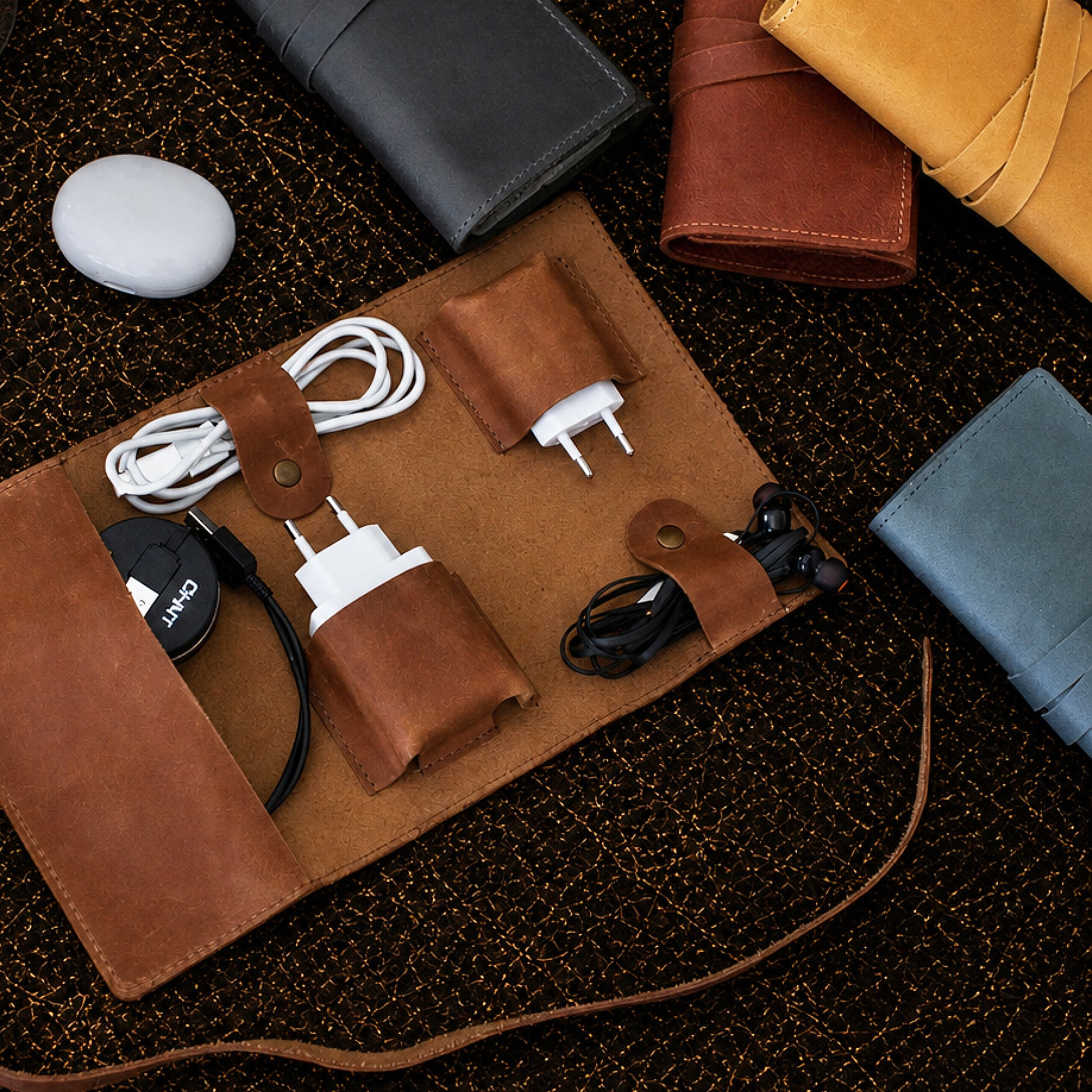 Interior of leather cord organizer, organized pockets for cables and accessories