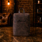 The Stride Sleeve leather bag in use at gym, warm earthy tones