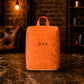 Collection of personalized leather shoe bags with engravings