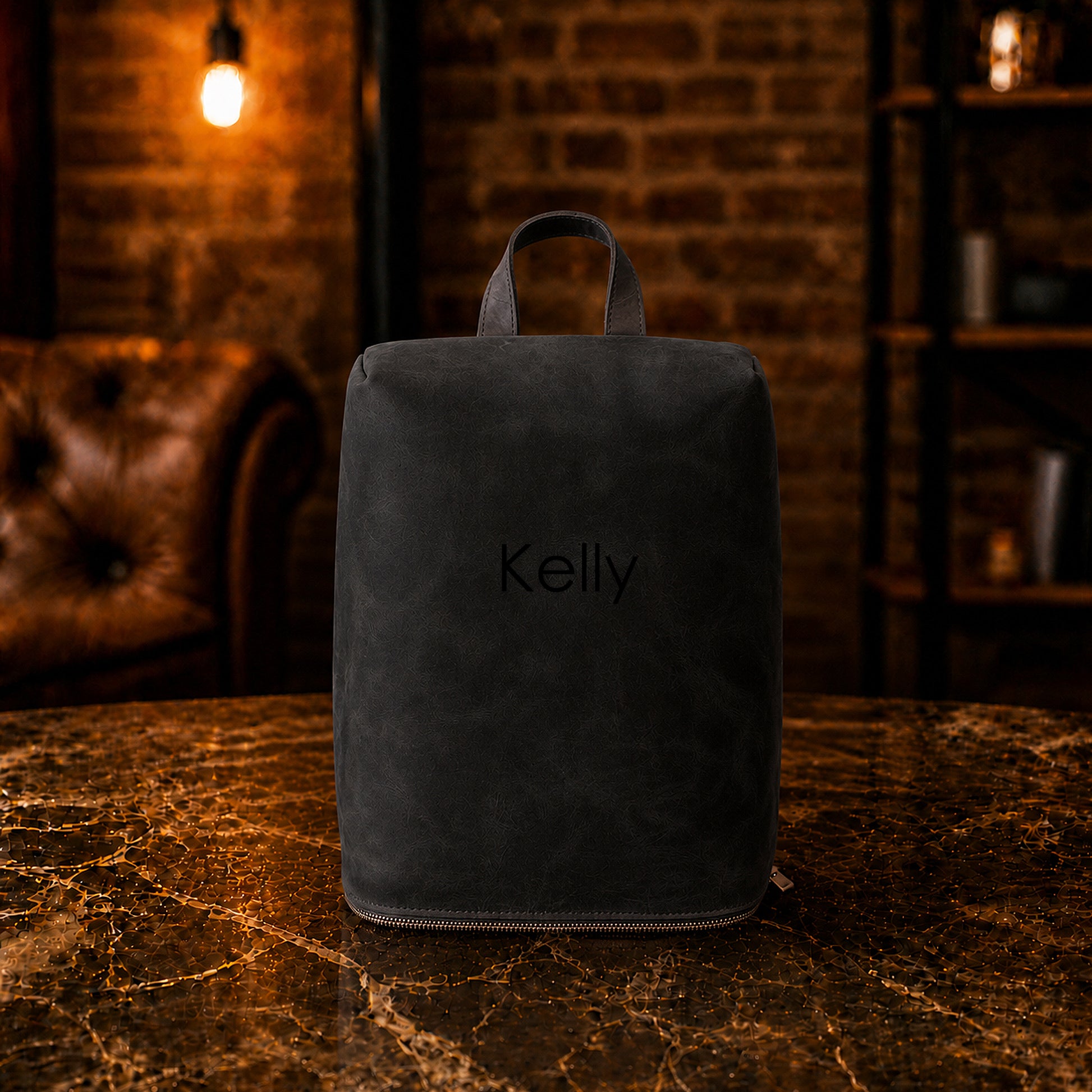 Multiple leather shoe bags with monogram initials on textured surface