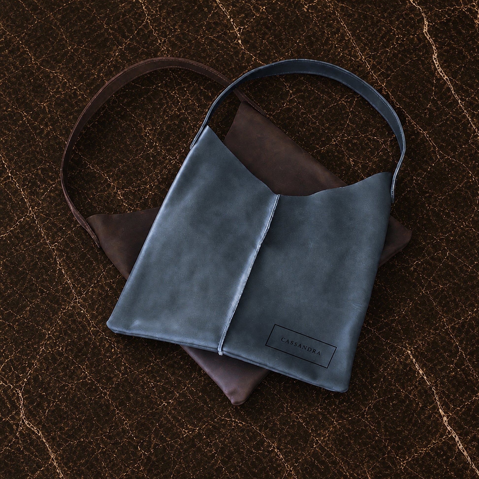 The Artisan Slouch leather bag in use outdoors, warm earthy tones