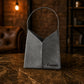 Brown leather tote bag with custom monogram engraving, front view