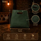 Green leather bag with measurements and features on a dark background
