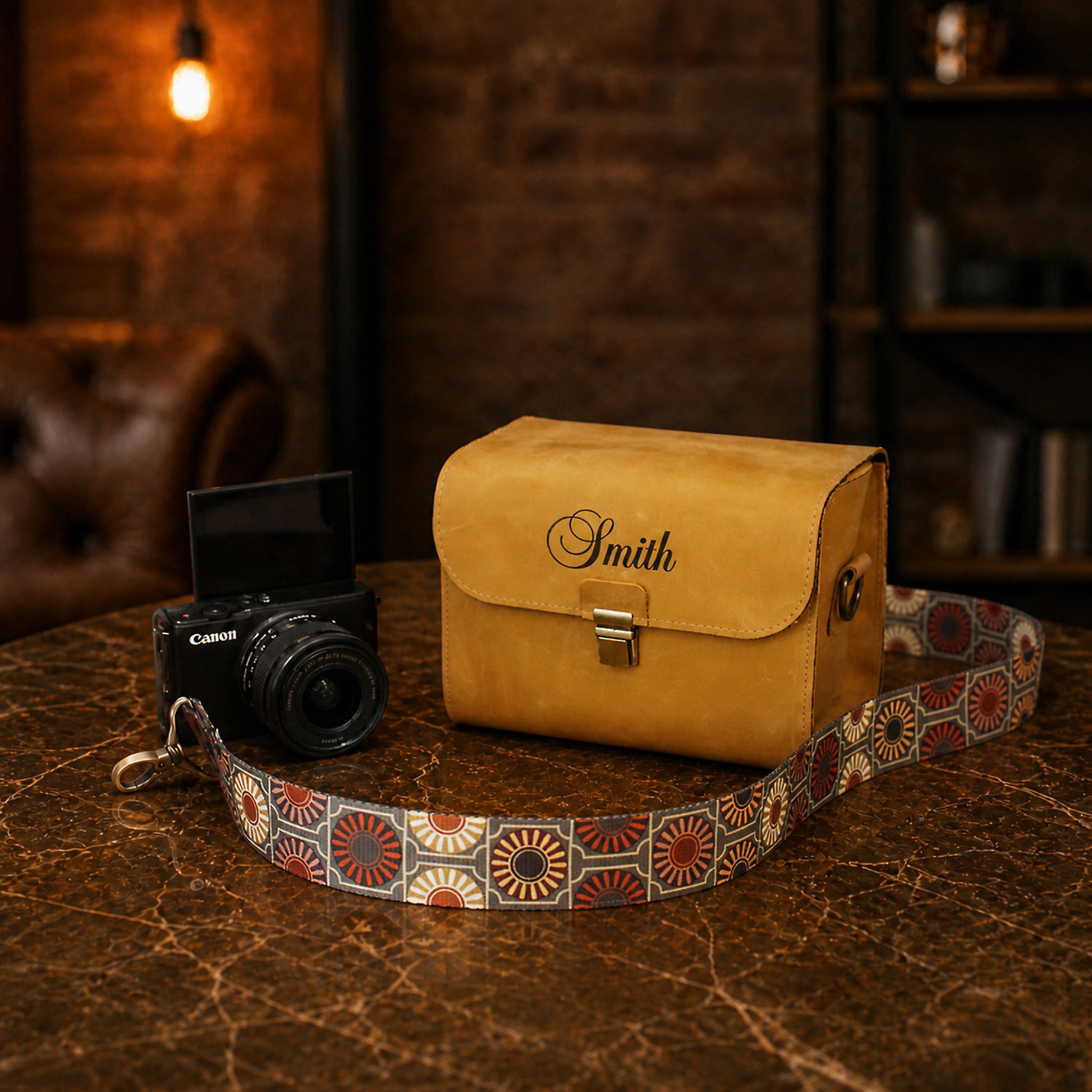 Leather camera bag in tan color with personalized stamp, product variant