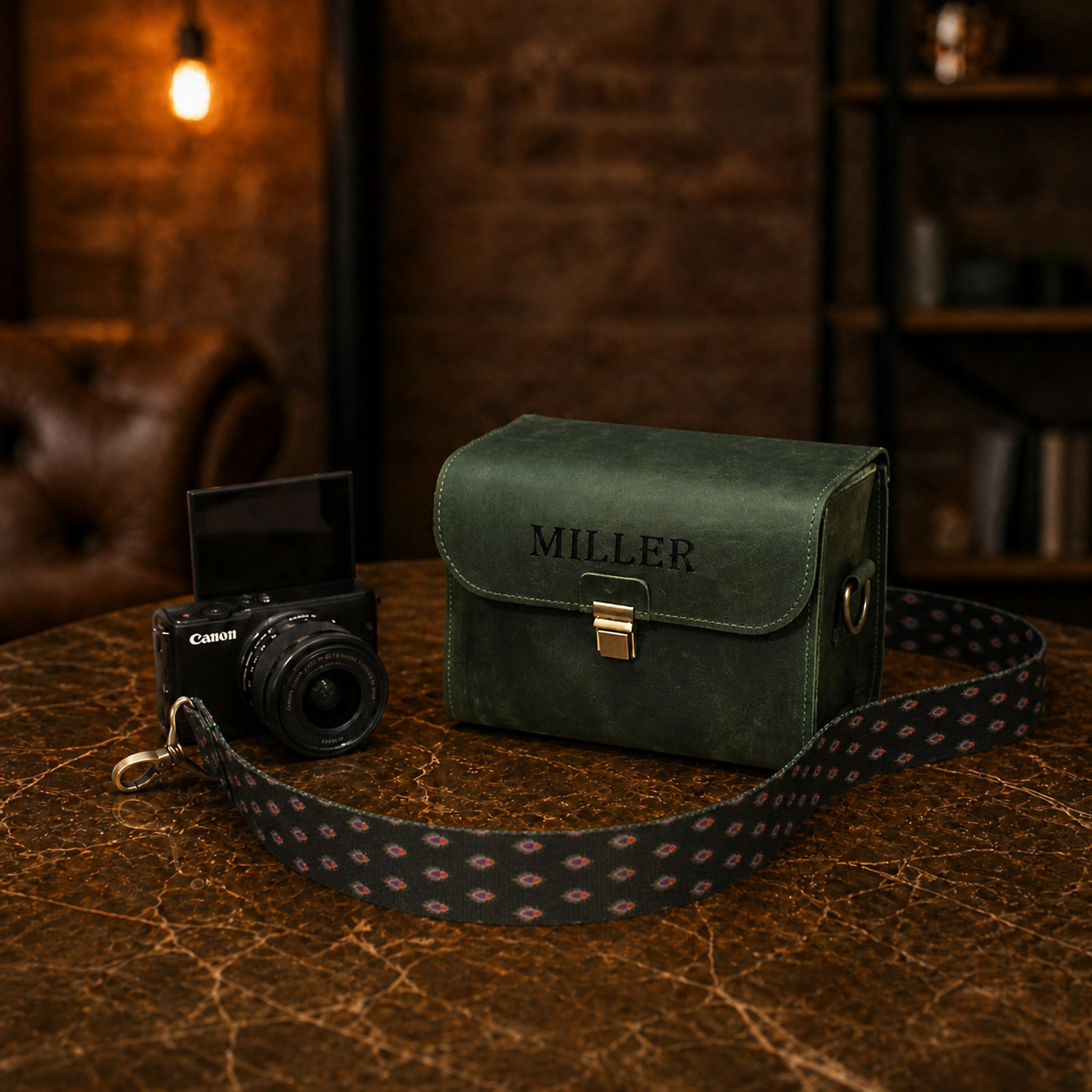 Dark brown leather camera bag with custom monogram, premium finish