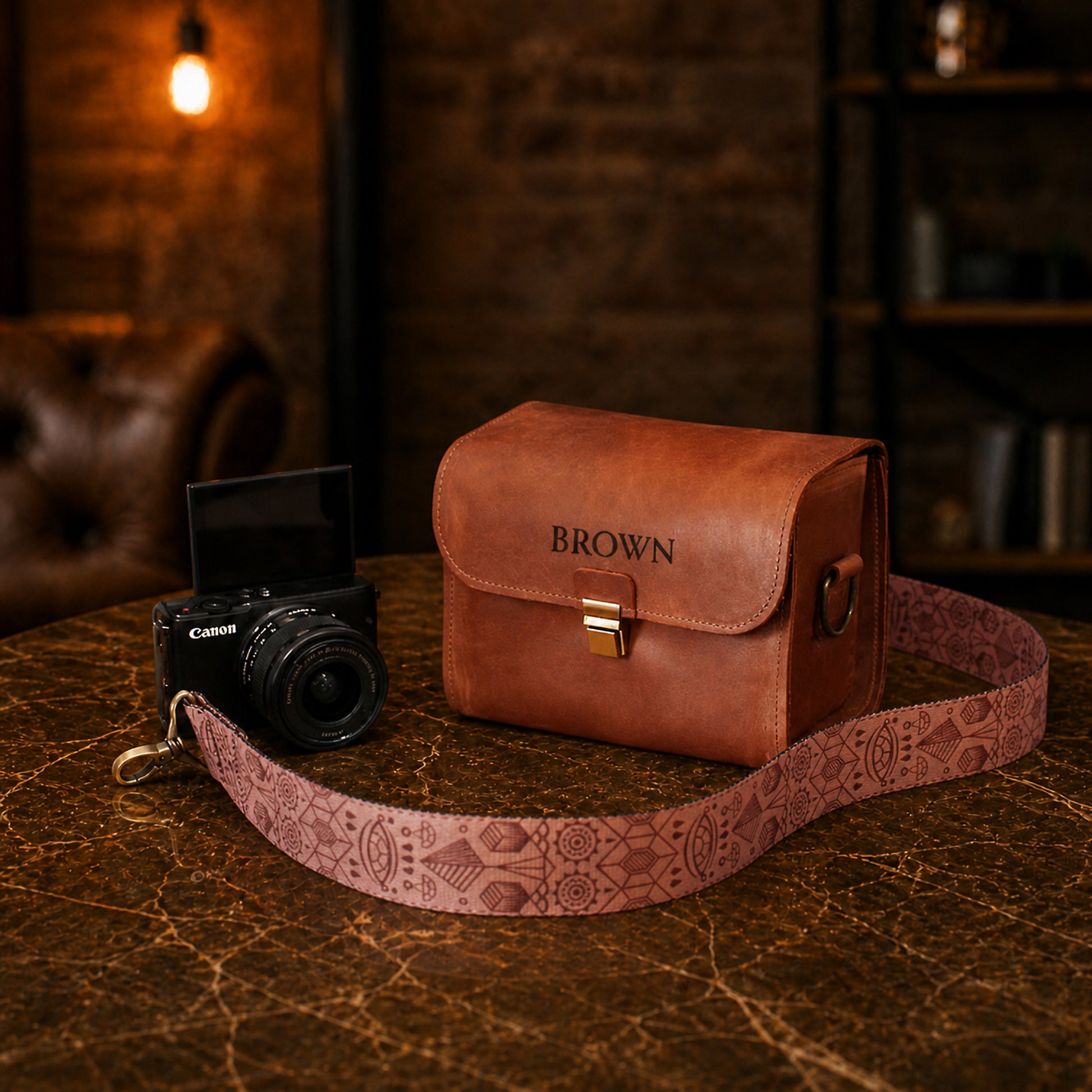 Natural leather camera bag with warm patina, artisan craftsmanship