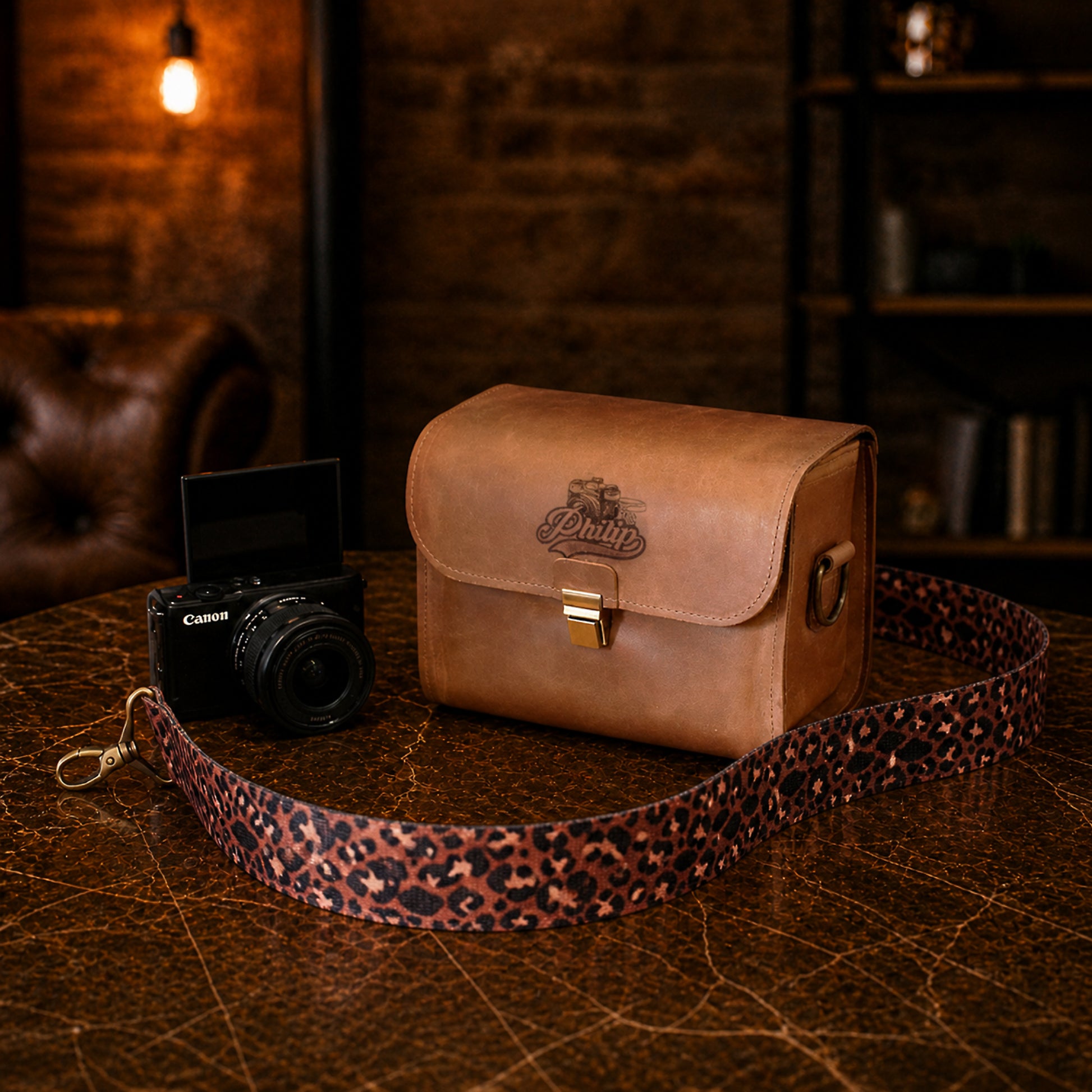Personalized leather camera bag as a gift, elegant packaging detail