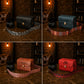 Brown leather camera bag with custom monogram engraving, front view