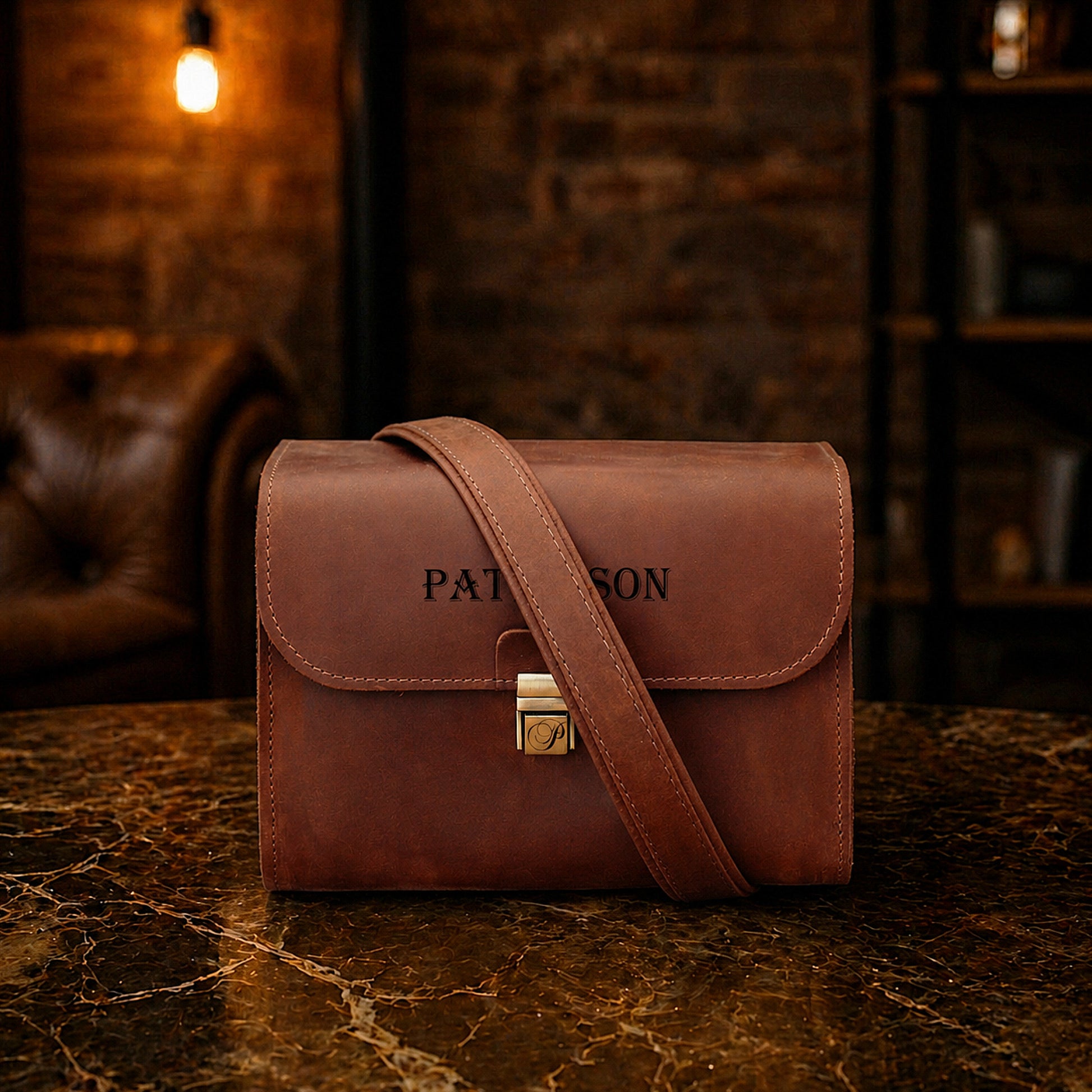 Close-up of leather camera bag strap and hardware detail