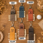 Six personalized golf keychains arranged in a 2x3 grid on a wooden background, each labeled with a color name: Gray, Denim, Brown, Yellow, Tawny, and Chocolate. The keychains feature a leather roll-top strap with multiple pointed wooden spikes, a metal clasp, and engraved names or logos.